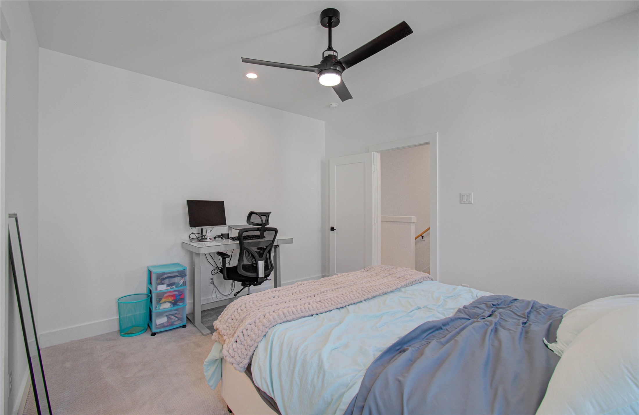 3032 Lamar Street Houston, TX 77003 - Photo 27 of 37 a bedroom with a bed and a tv