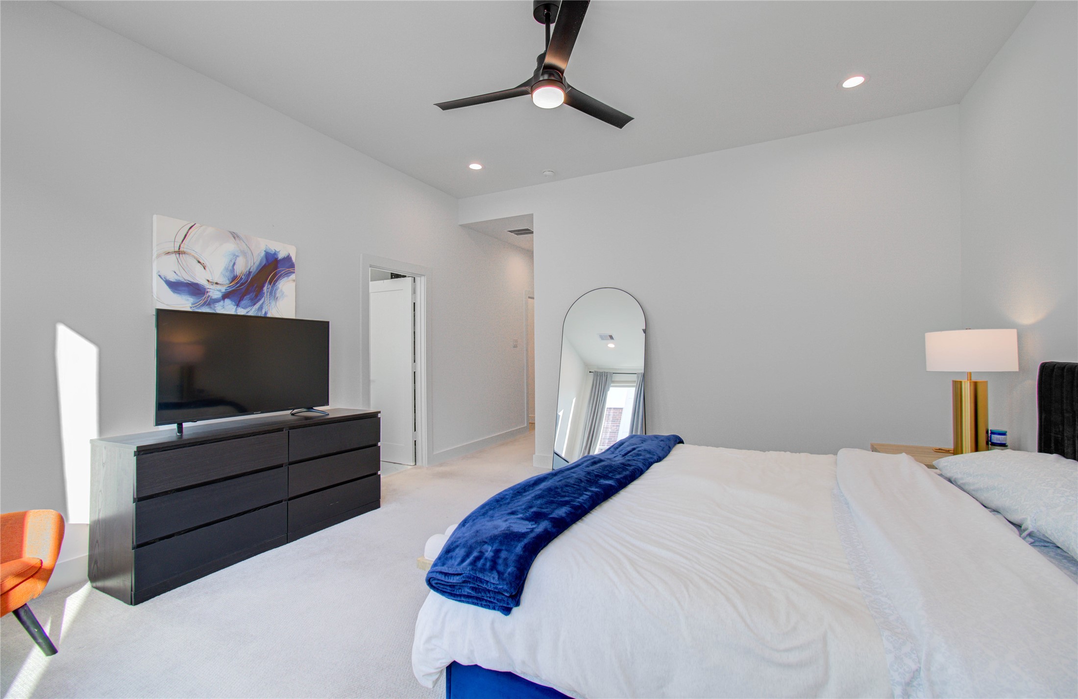 3032 Lamar Street Houston, TX 77003 - Photo 30 of 37 a bedroom with a bed and a flat screen tv