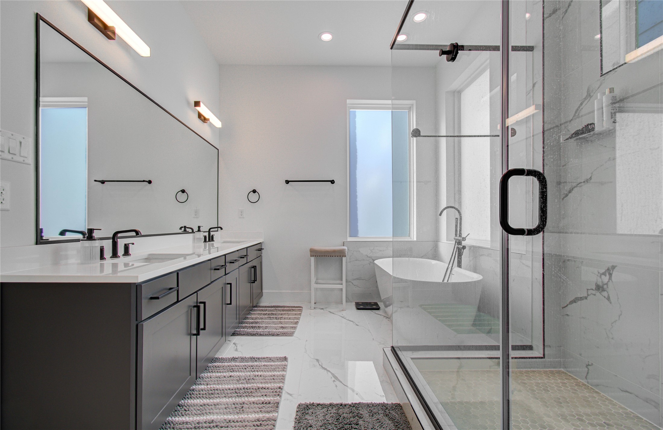 3032 Lamar Street Houston, TX 77003 - Photo 32 of 37 a spacious bathroom with a double vanity sink mirror and shower