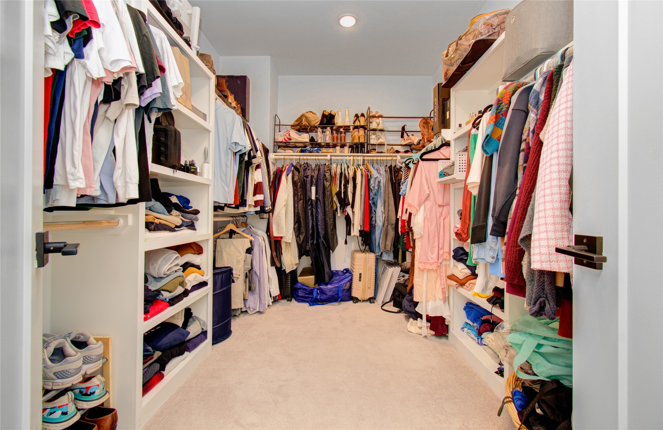 3032 Lamar Street Houston, TX 77003 - Photo 35 of 37 a view of walk in closet with clothes and shoes