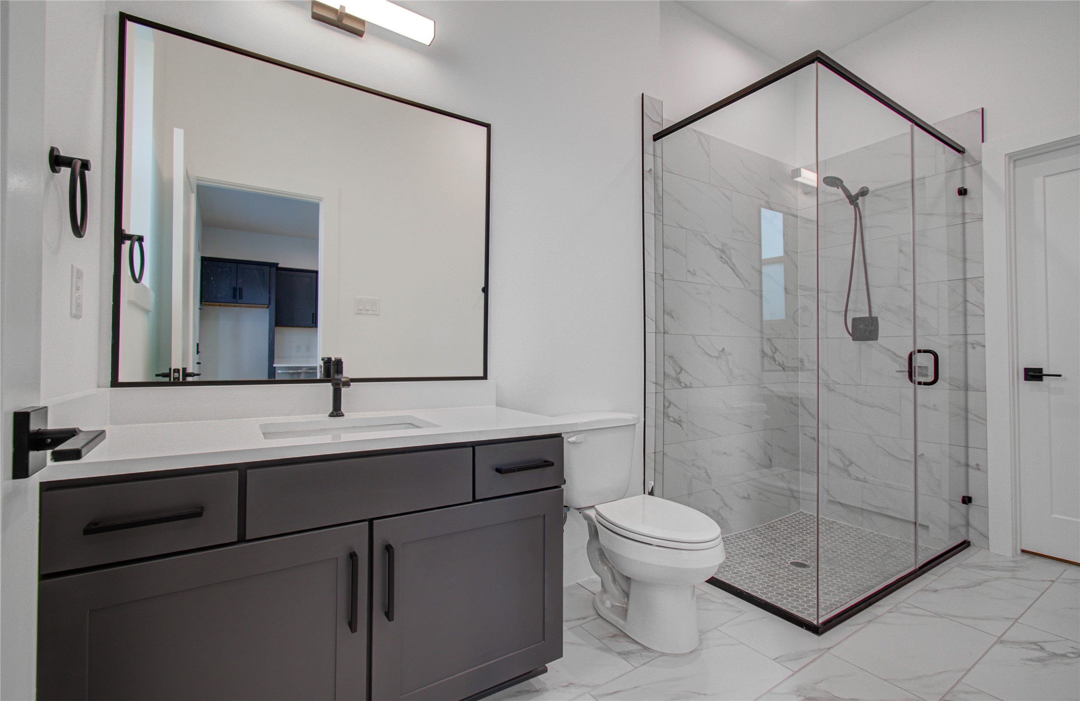 3032 Lamar Street Houston, TX 77003 - Photo 9 of 37 a bathroom with a toilet a sink and shower