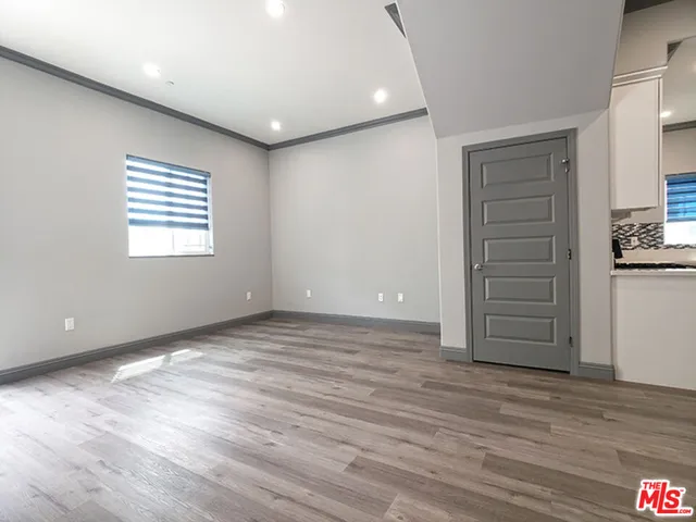 a view of an empty room with a closet