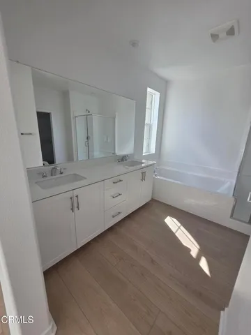 a view of cabinets with wooden floor
