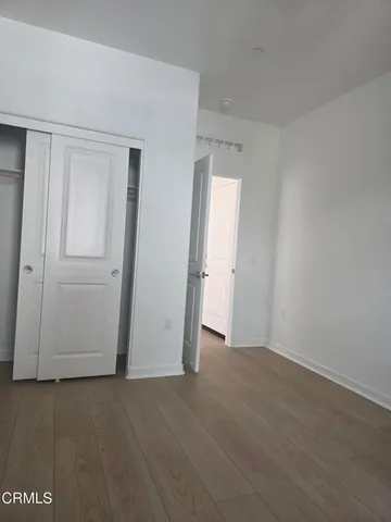 an empty room with closet area