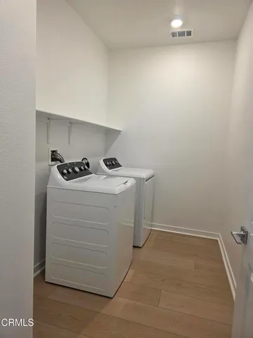 a utility room with washer and dryer