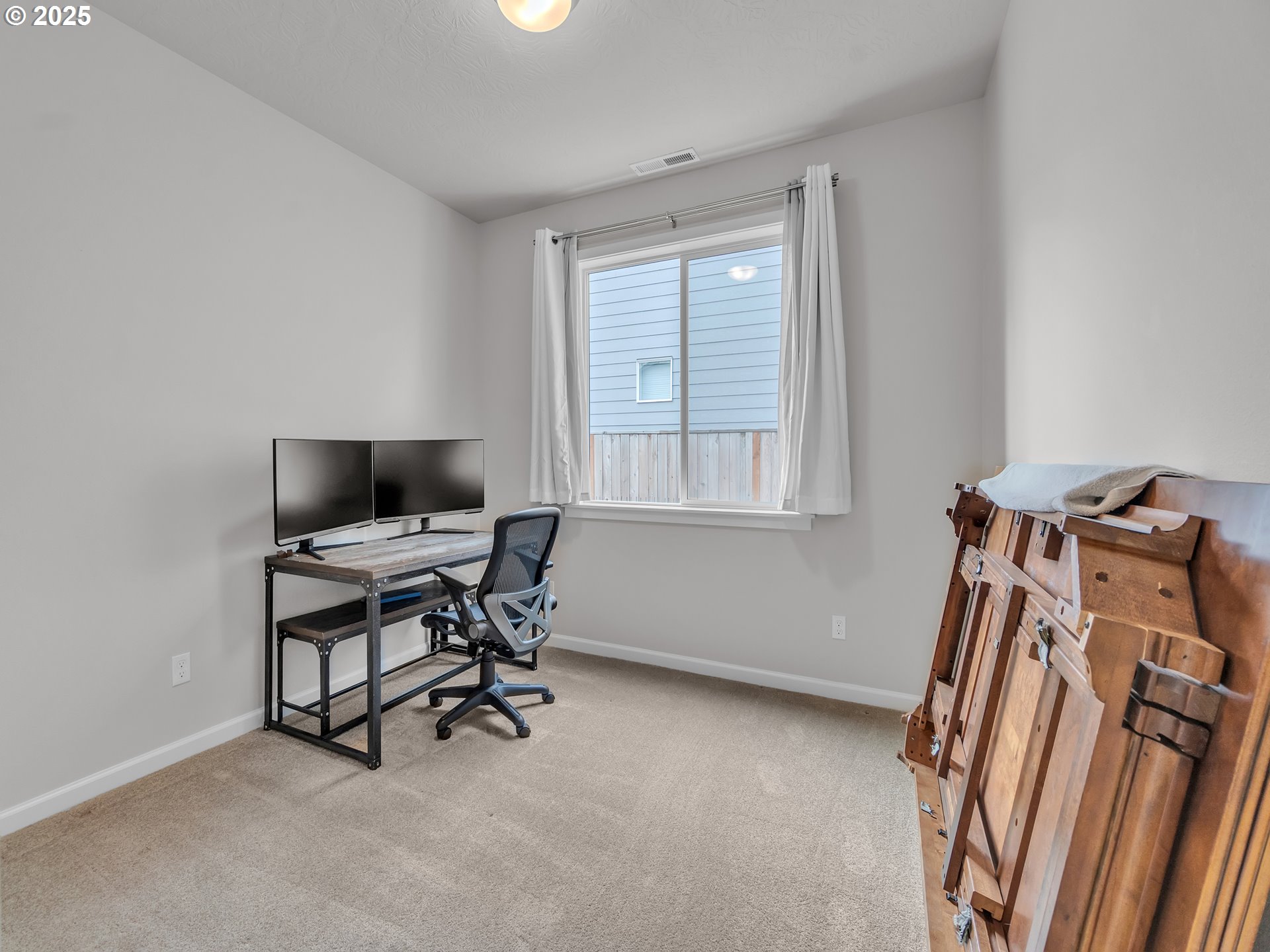 893 East Cleveland Street Carlton, OR 97111 - Photo 15 of 19 a view of a workspace with furniture and a window
