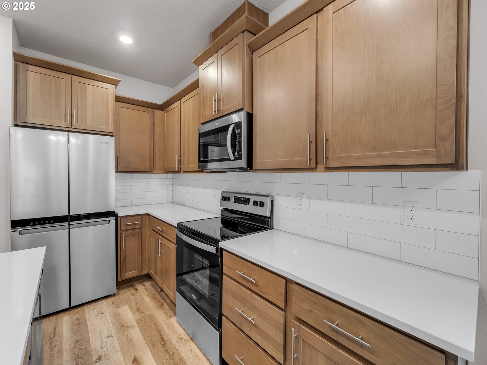 893 East Cleveland Street Carlton, OR 97111 - Photo 7 of 19 a kitchen with stainless steel appliances granite countertop a refrigerator sink and microwave