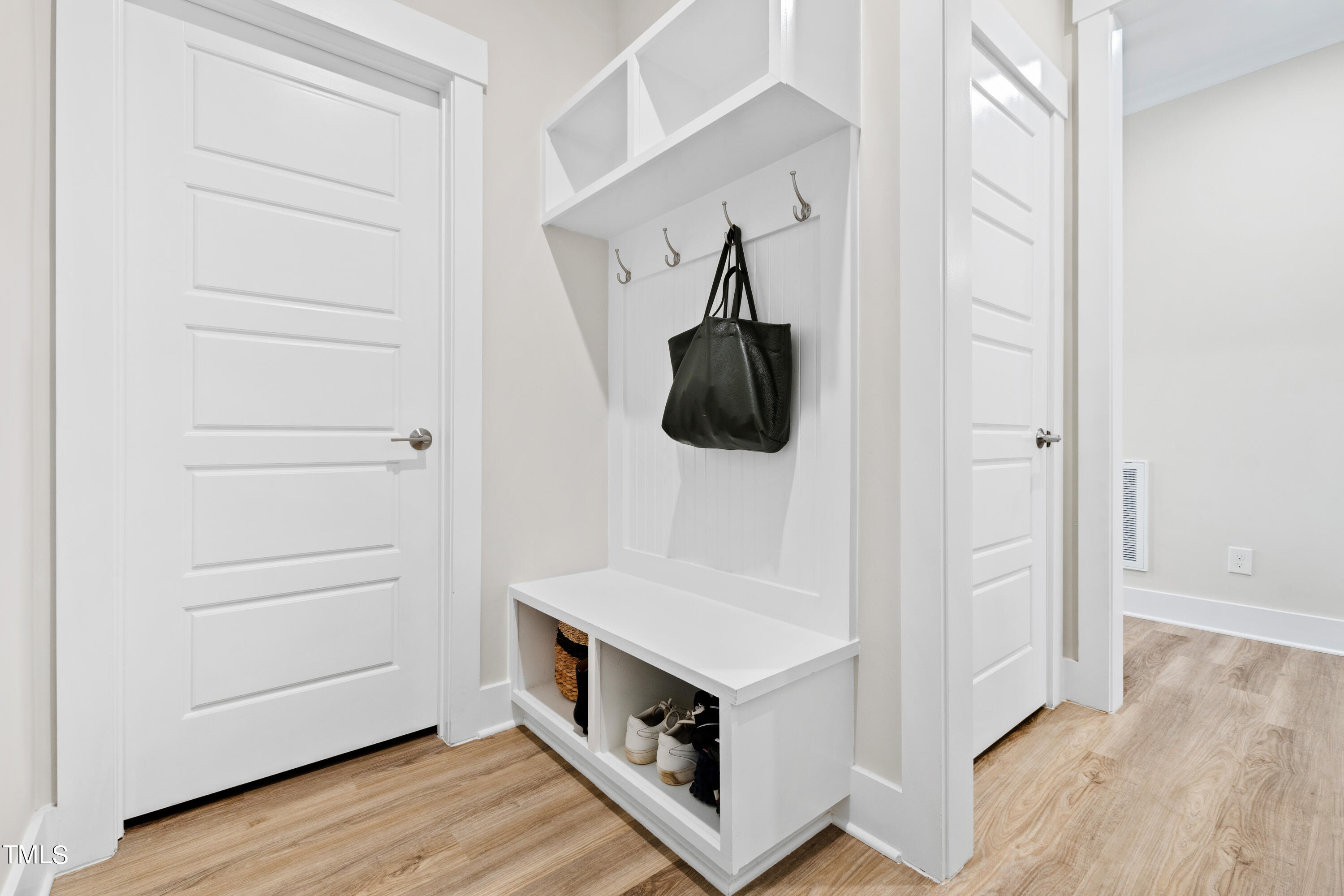 119 Dunloe Loop Raleigh, NC 27603 - Photo 11 of 51 a kitchen with white cabinets and white appliances