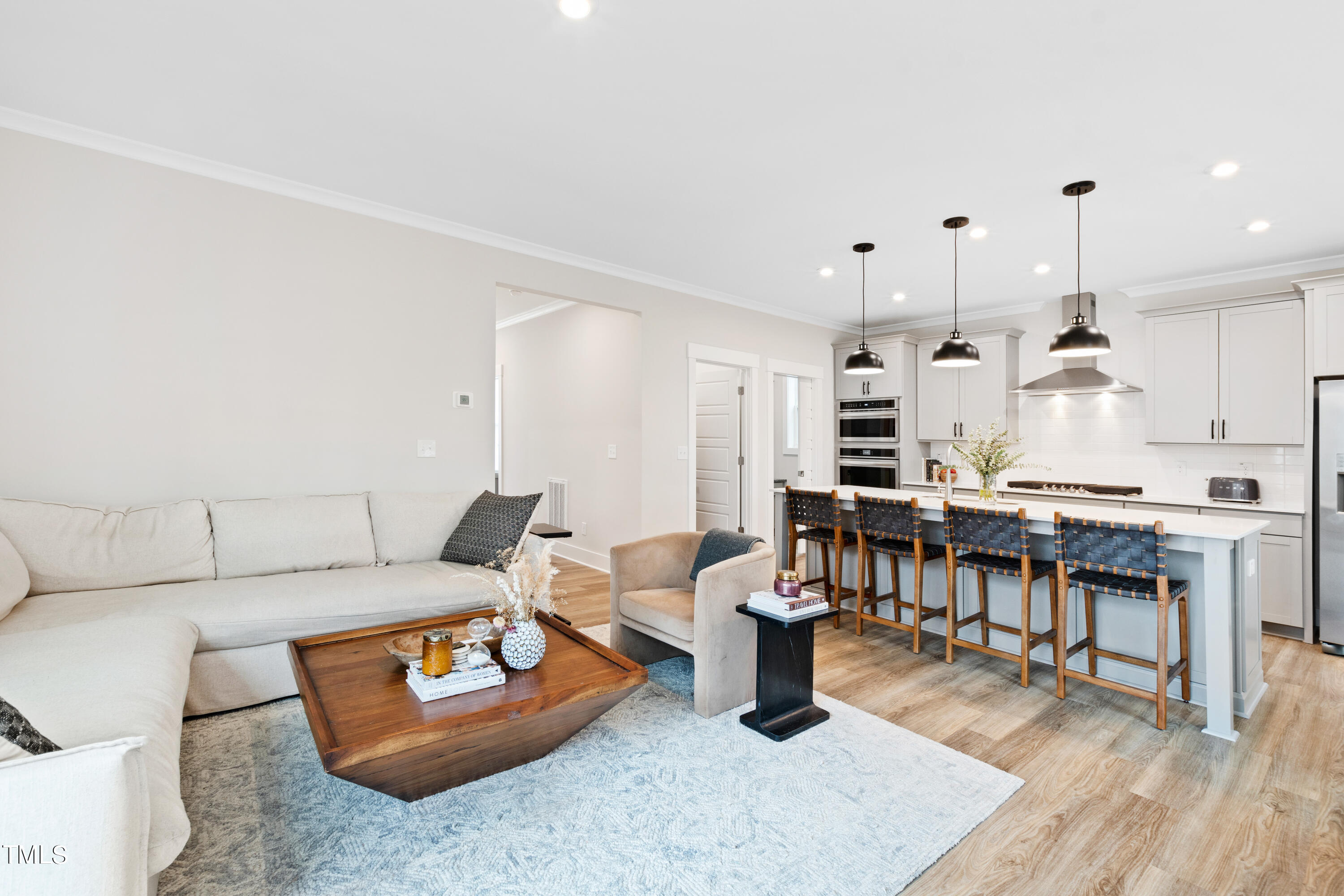 119 Dunloe Loop Raleigh, NC 27603 - Photo 14 of 51 a living room with furniture and a wooden floor