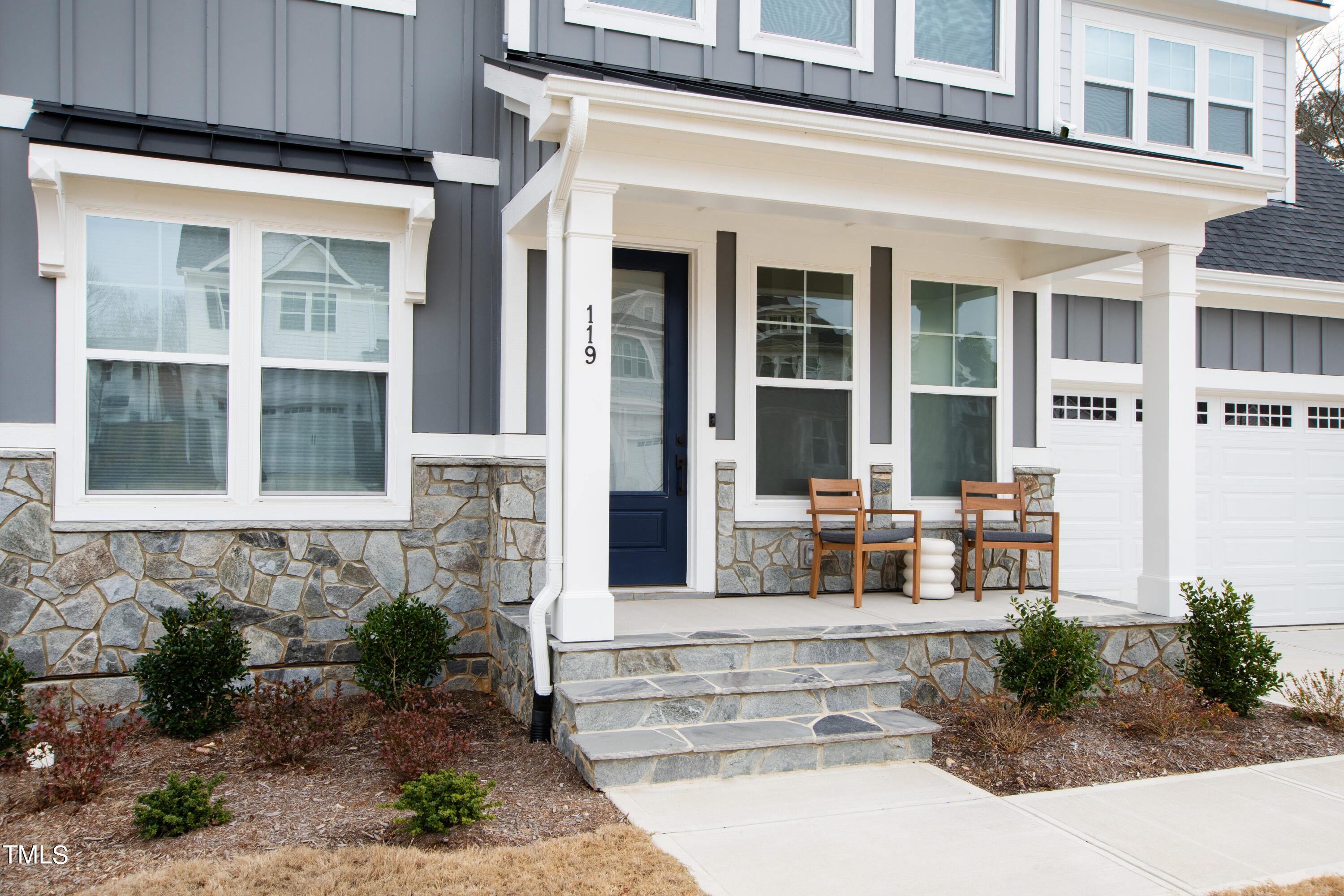 119 Dunloe Loop Raleigh, NC 27603 - Photo 2 of 51 a front view of a house with a garden
