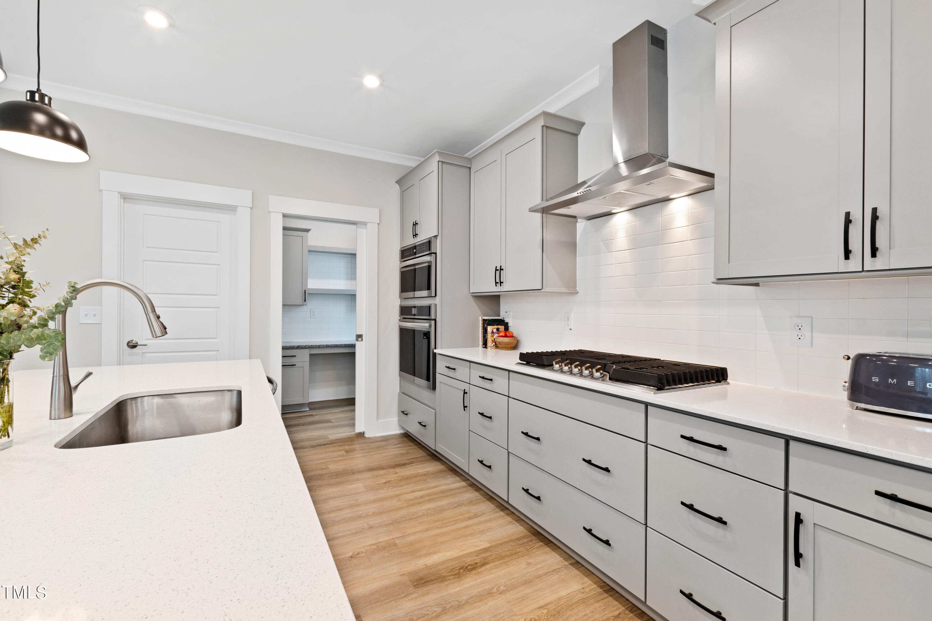 119 Dunloe Loop Raleigh, NC 27603 - Photo 21 of 51 a kitchen with cabinets a sink and appliances