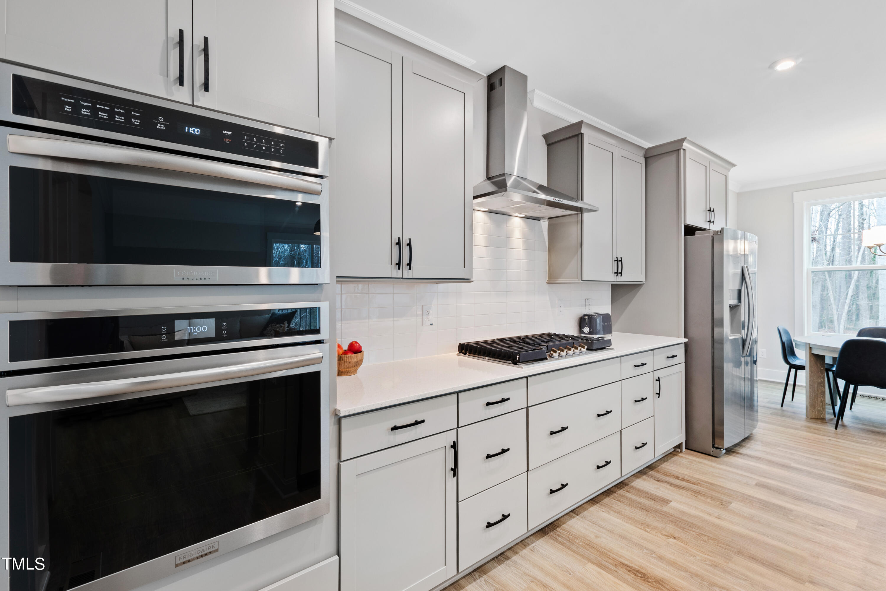 119 Dunloe Loop Raleigh, NC 27603 - Photo 23 of 51 a kitchen with granite countertop cabinets and steel stainless steel appliances
