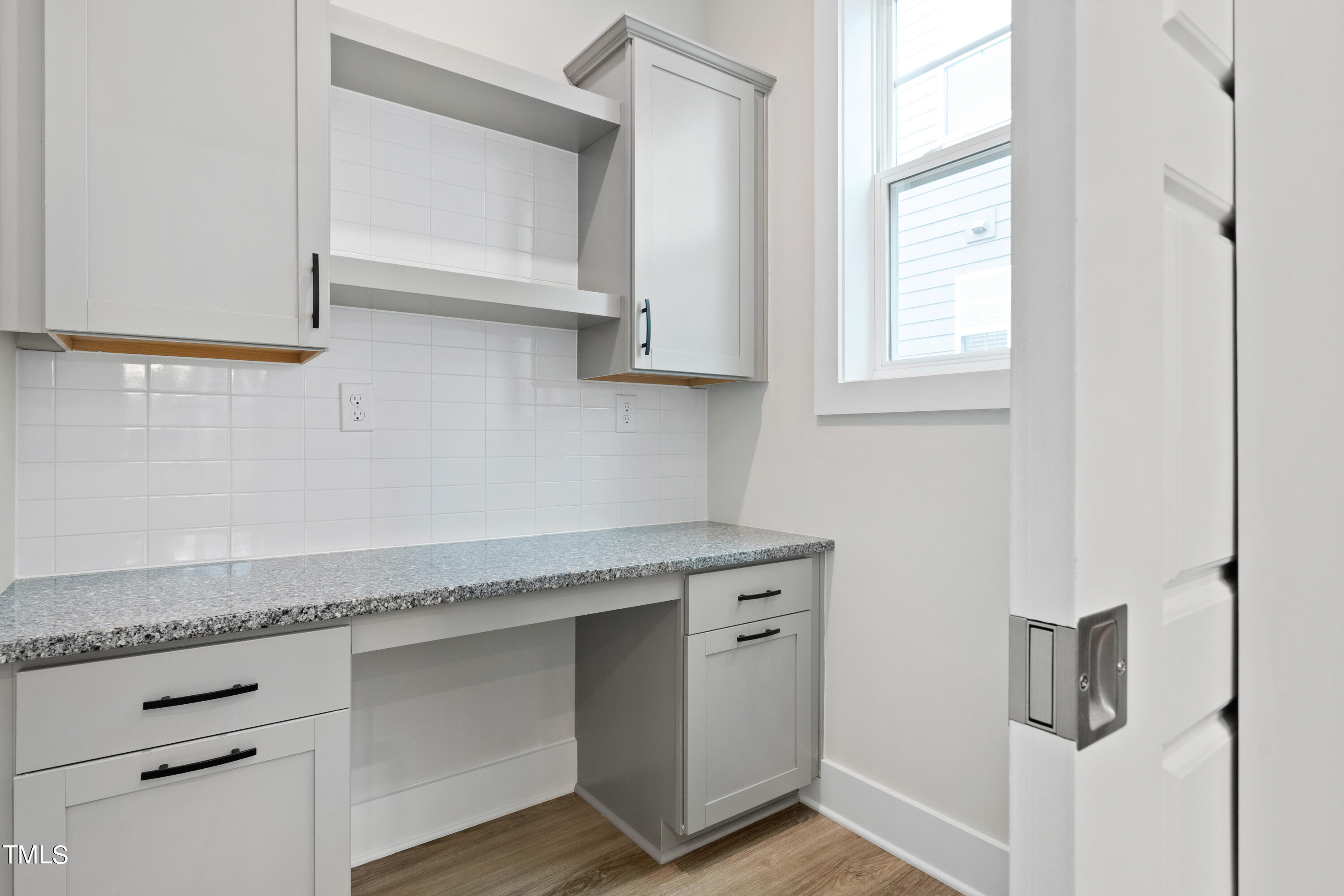 119 Dunloe Loop Raleigh, NC 27603 - Photo 25 of 51 a kitchen with granite countertop white cabinets and white appliances
