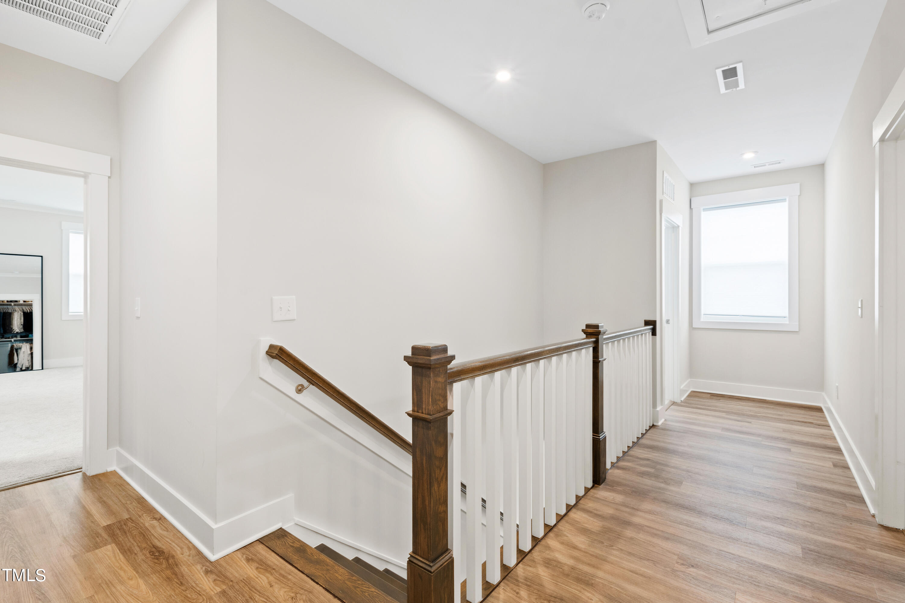 119 Dunloe Loop Raleigh, NC 27603 - Photo 27 of 51 a view of a hallway with wooden floor