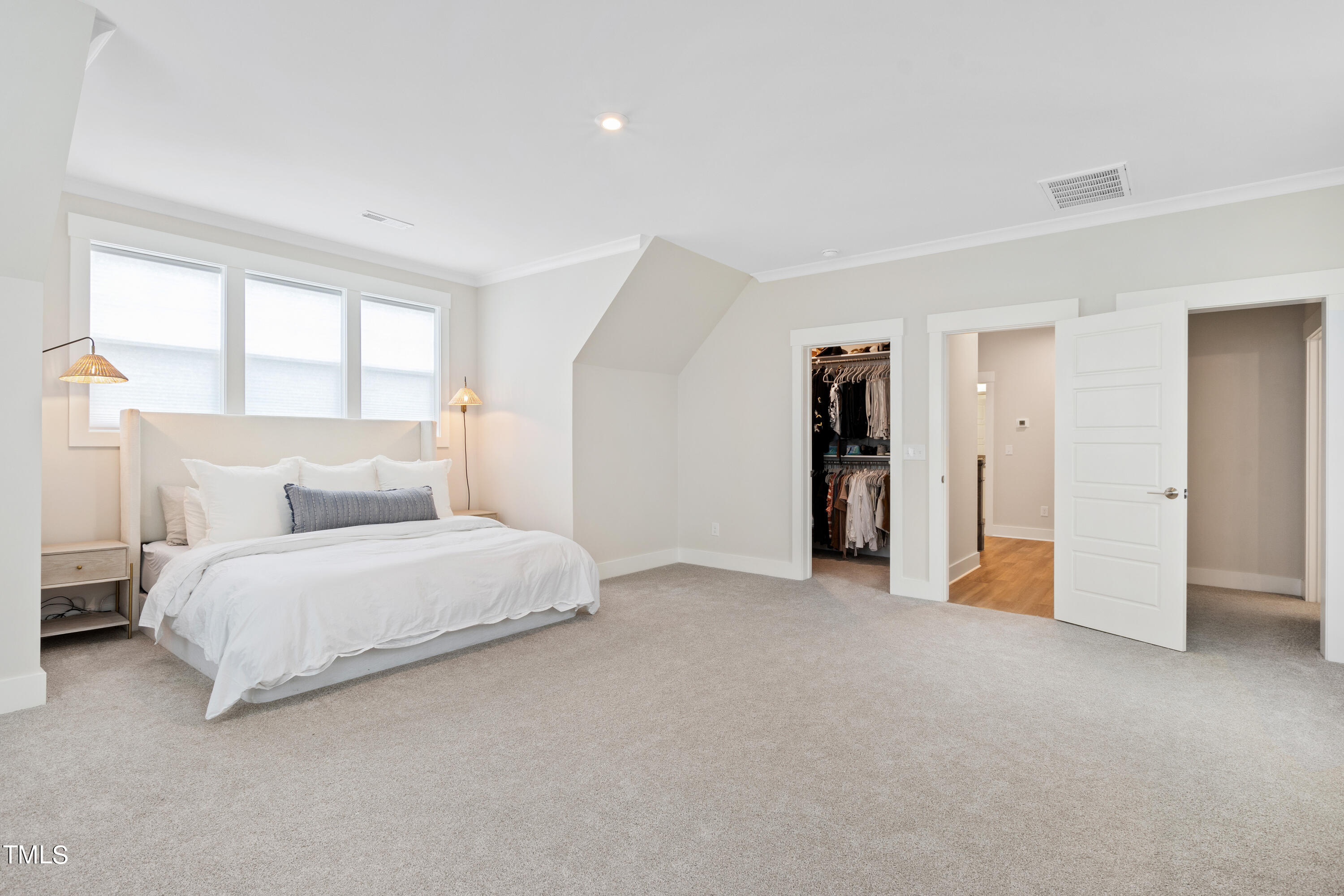 119 Dunloe Loop Raleigh, NC 27603 - Photo 30 of 51 a spacious bedroom with a bed and a window