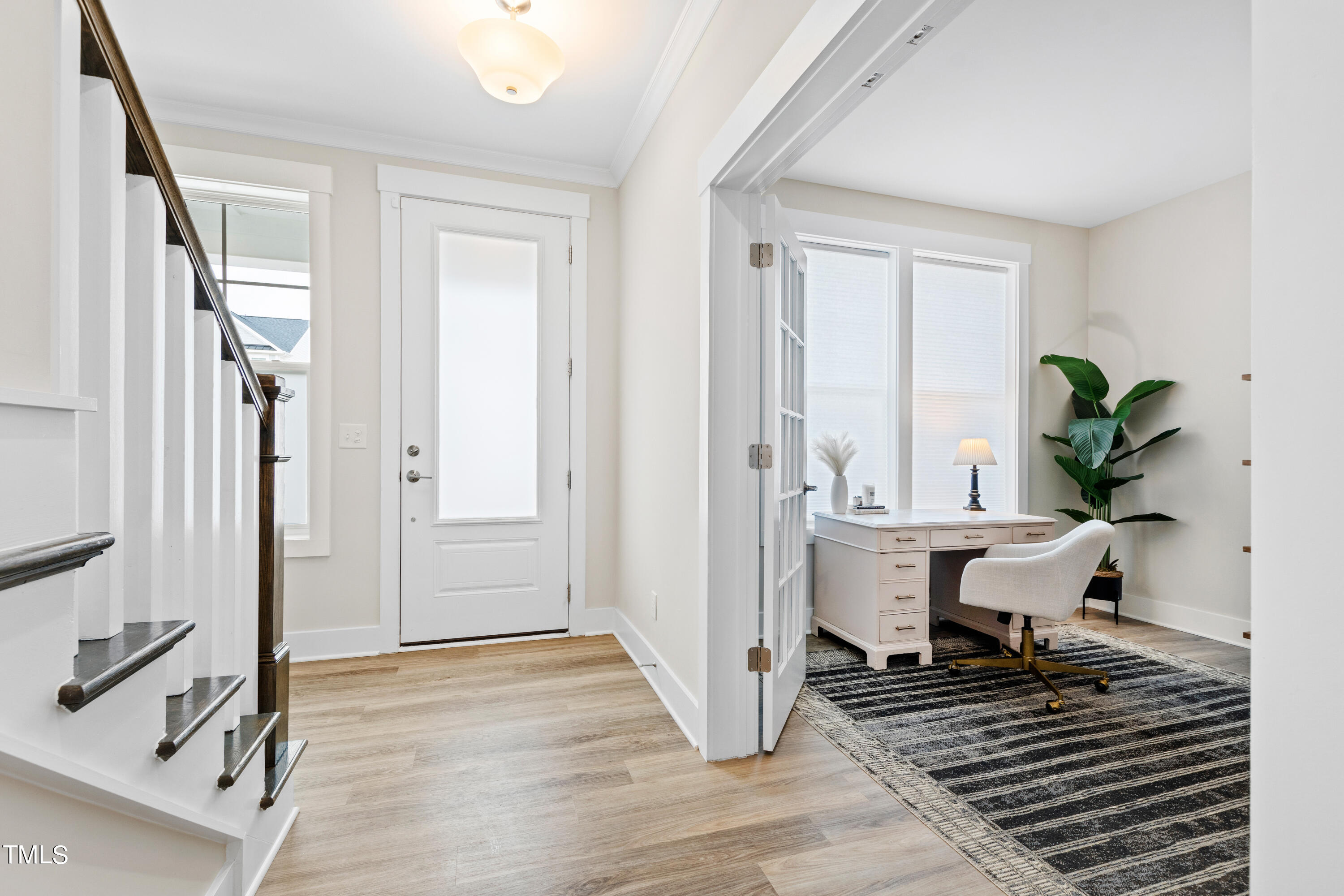 119 Dunloe Loop Raleigh, NC 27603 - Photo 3 of 51 a view of a workspace with furniture and a window