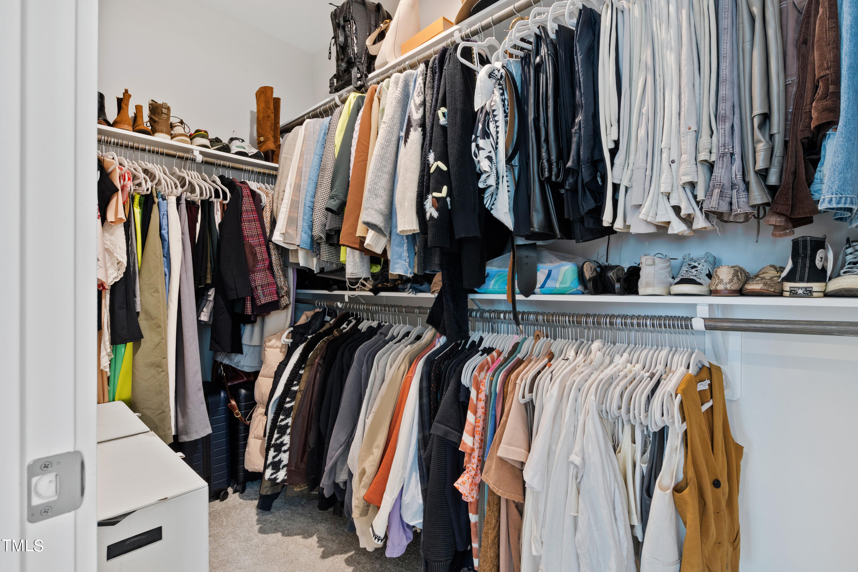 119 Dunloe Loop Raleigh, NC 27603 - Photo 31 of 51 a view of walk in closet with clothes and shoes
