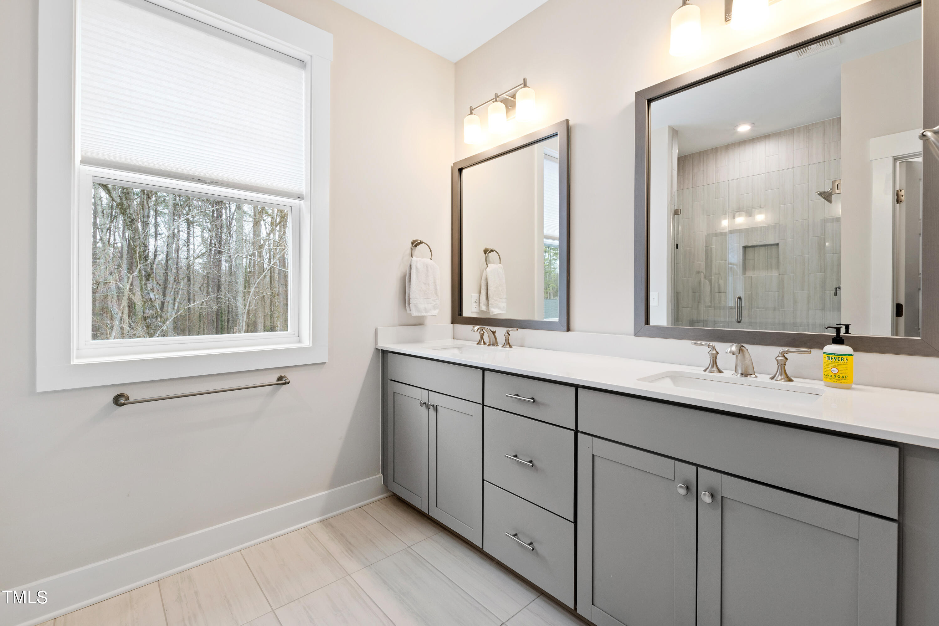 119 Dunloe Loop Raleigh, NC 27603 - Photo 32 of 51 a bathroom with a sink and a mirror