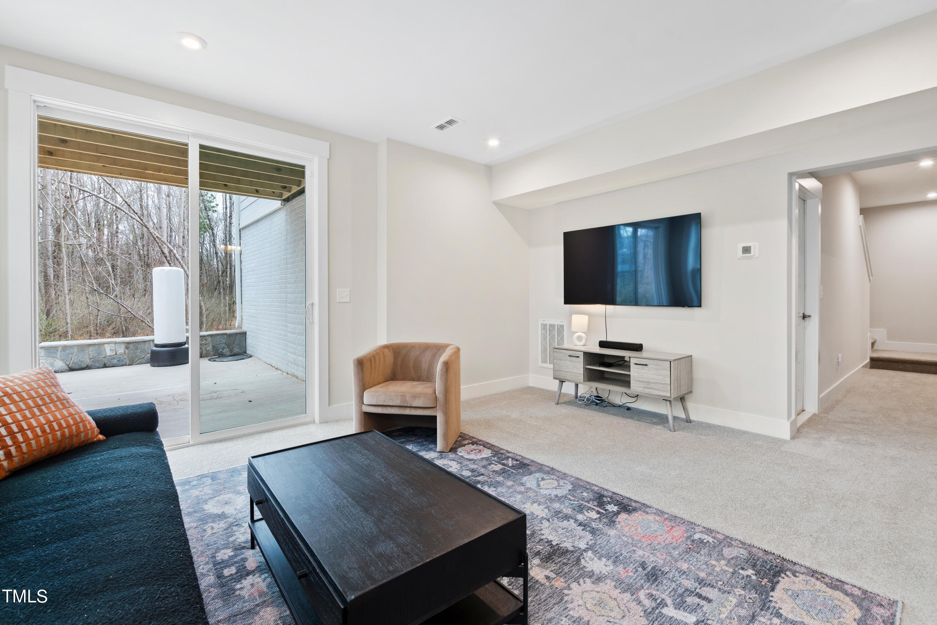 119 Dunloe Loop Raleigh, NC 27603 - Photo 41 of 51 a living room with furniture and a flat screen tv