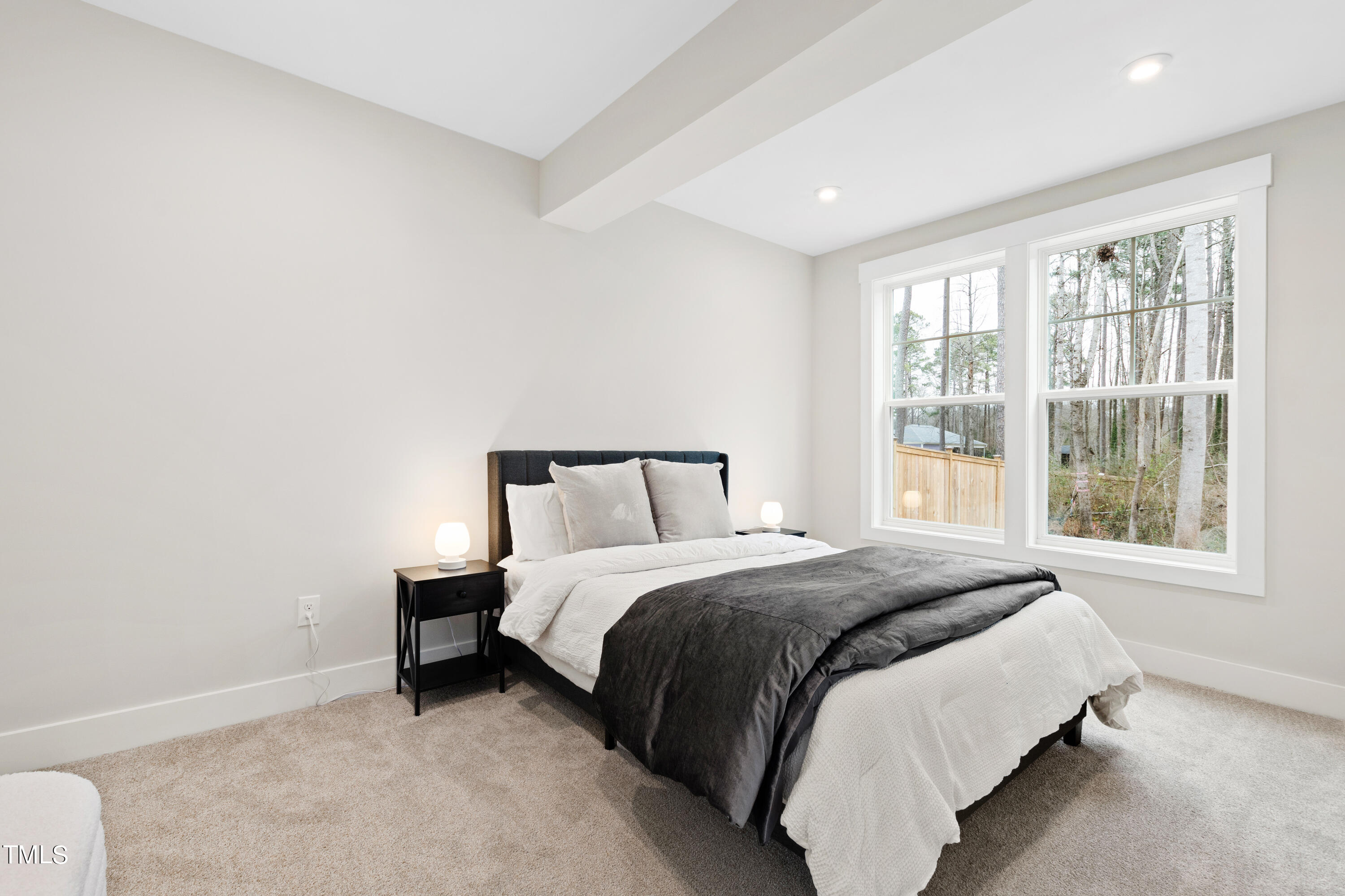 119 Dunloe Loop Raleigh, NC 27603 - Photo 42 of 51 a spacious bedroom with a bed and a window