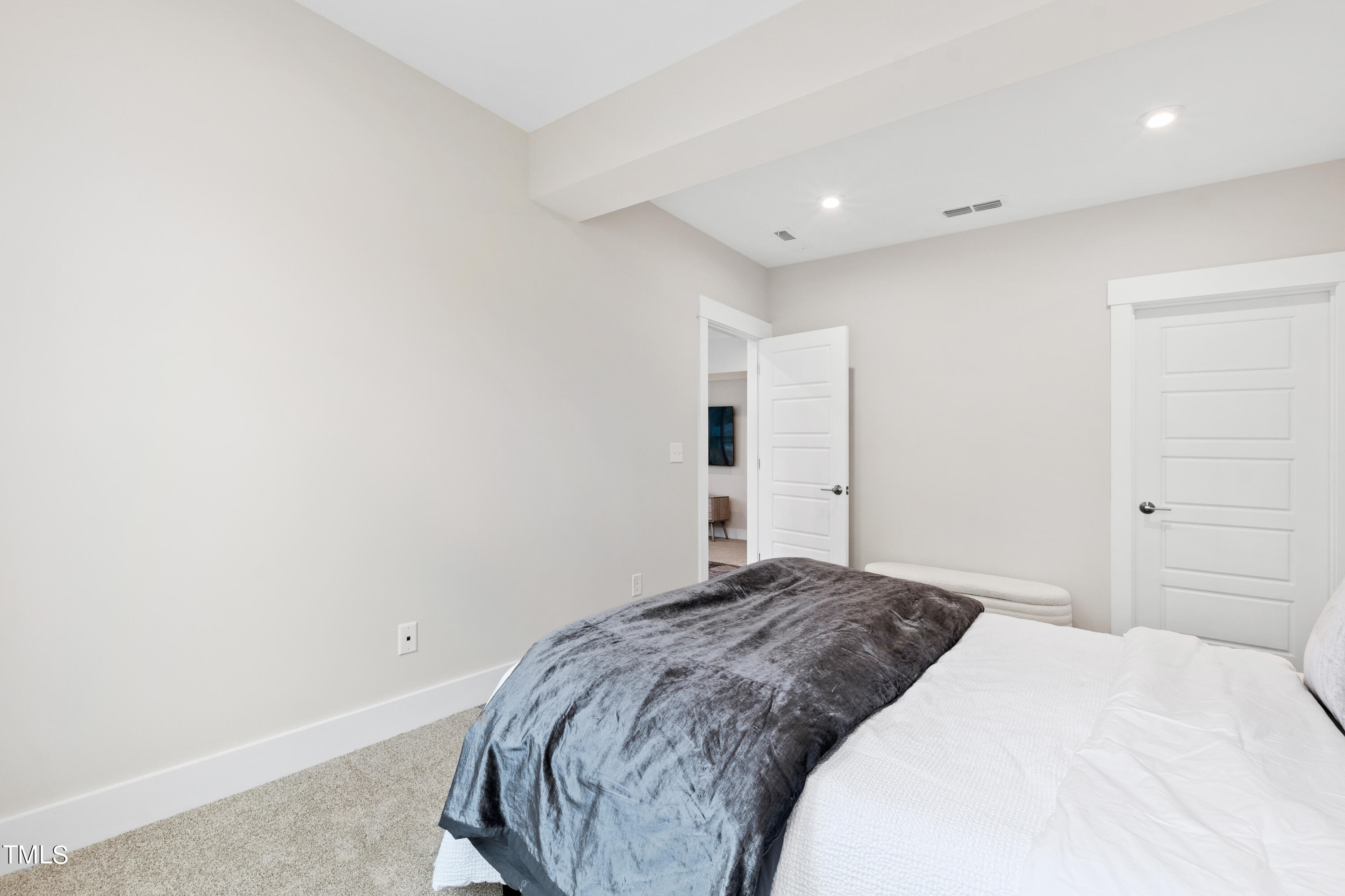 119 Dunloe Loop Raleigh, NC 27603 - Photo 43 of 51 a bedroom with a bed and a painting on the wall