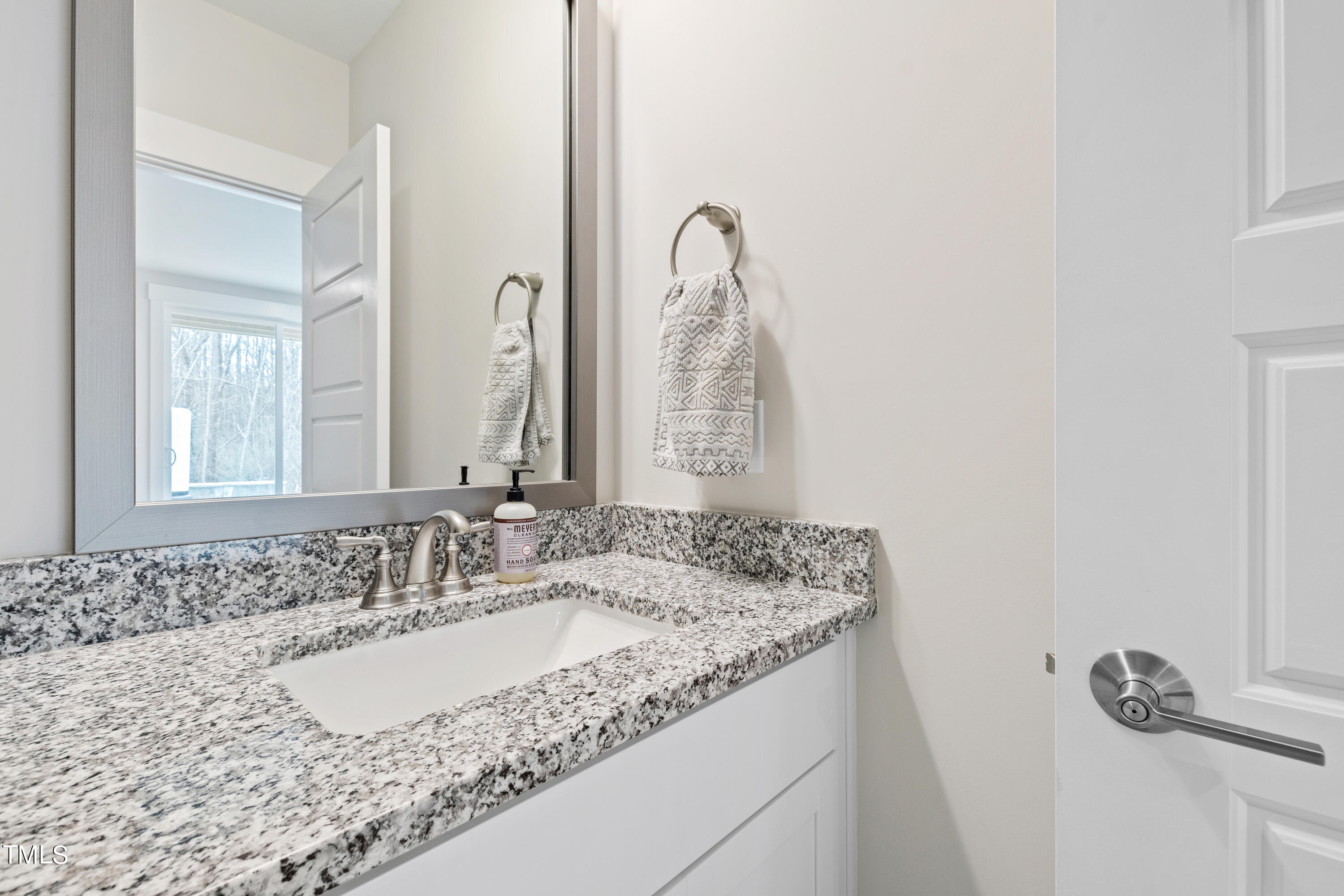 119 Dunloe Loop Raleigh, NC 27603 - Photo 44 of 51 a bathroom with a granite countertop sink and a mirror