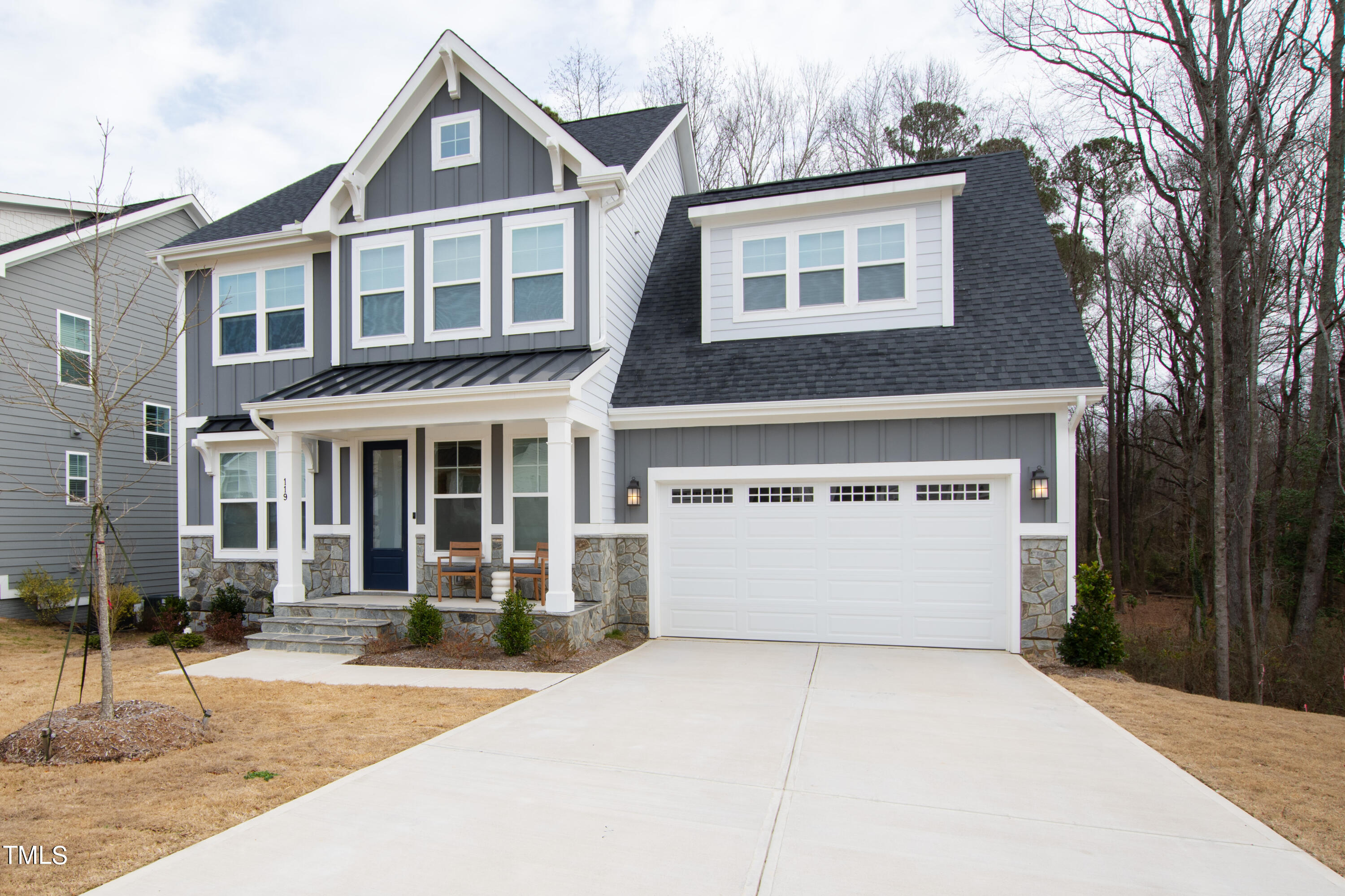 119 Dunloe Loop Raleigh, NC 27603 - Photo 51 of 51 a front view of a house with a yard and garage