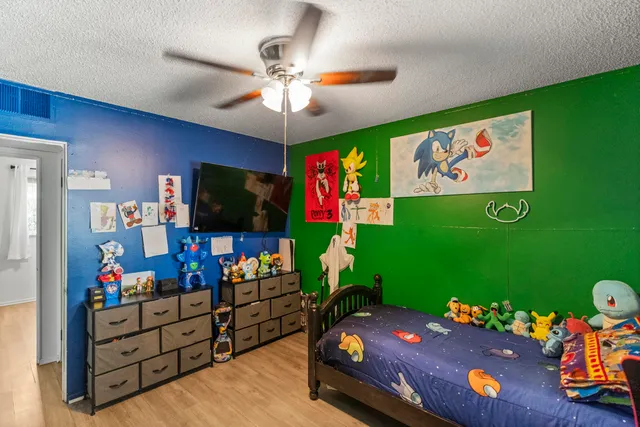 a room with furniture and a flat screen tv