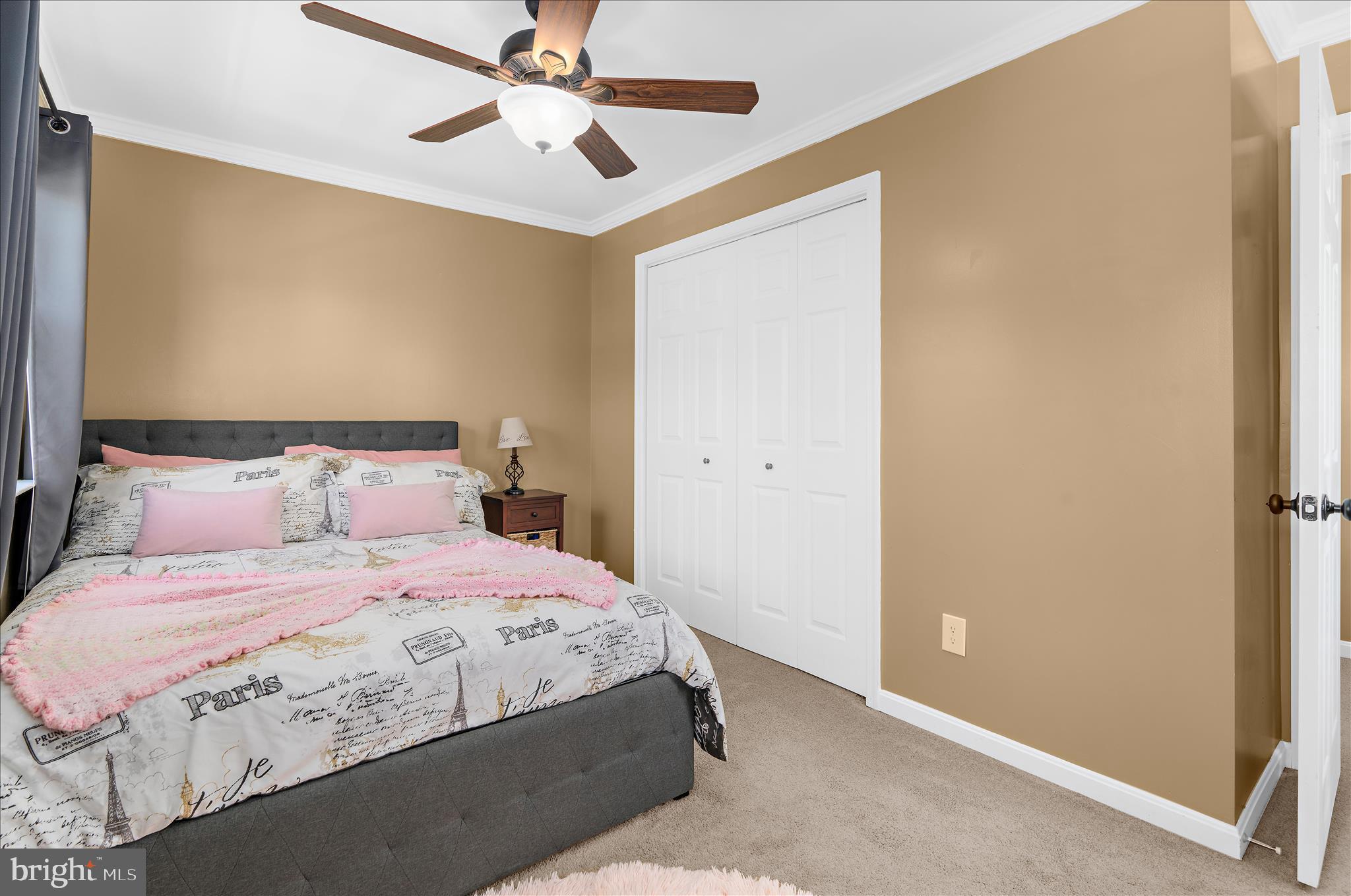 8028 High Oak Road Glen Burnie, MD 21060 - Photo 26 of 65 a bedroom with a bed and a ceiling fan