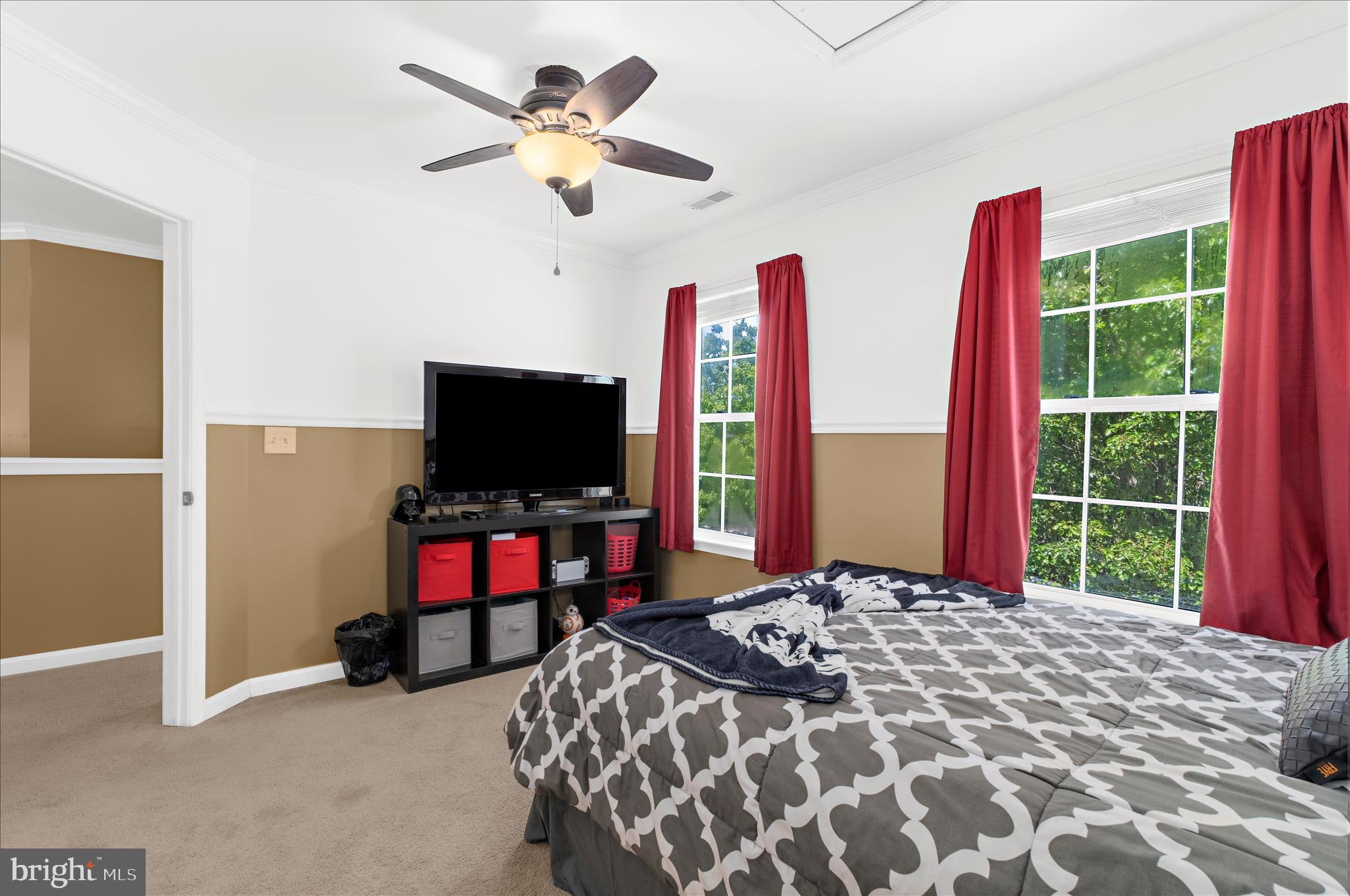 8028 High Oak Road Glen Burnie, MD 21060 - Photo 30 of 65 a bedroom with a bed and a flat screen tv