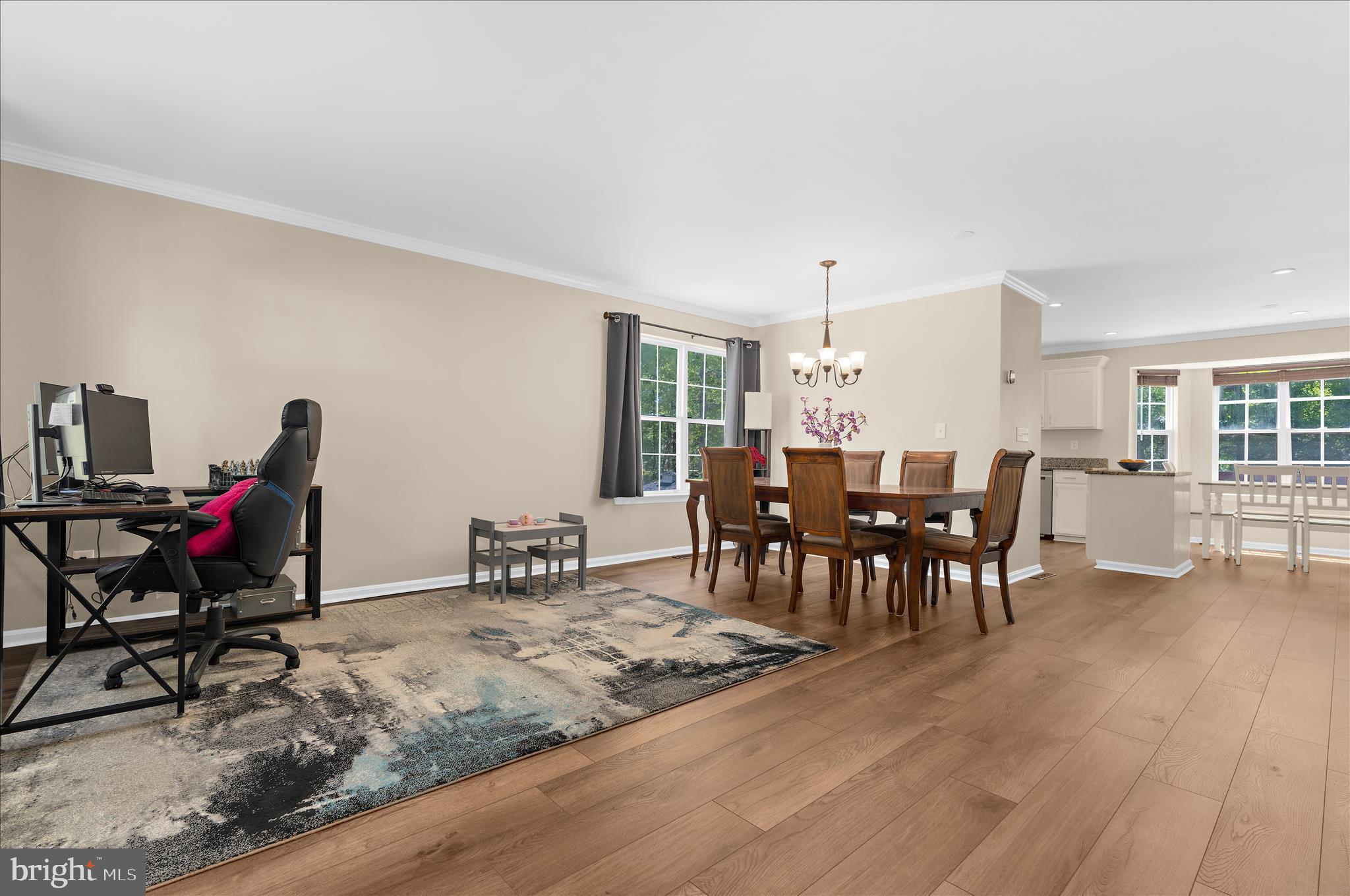 8028 High Oak Road Glen Burnie, MD 21060 - Photo 7 of 65 a view of a dining room with furniture and wooden floor