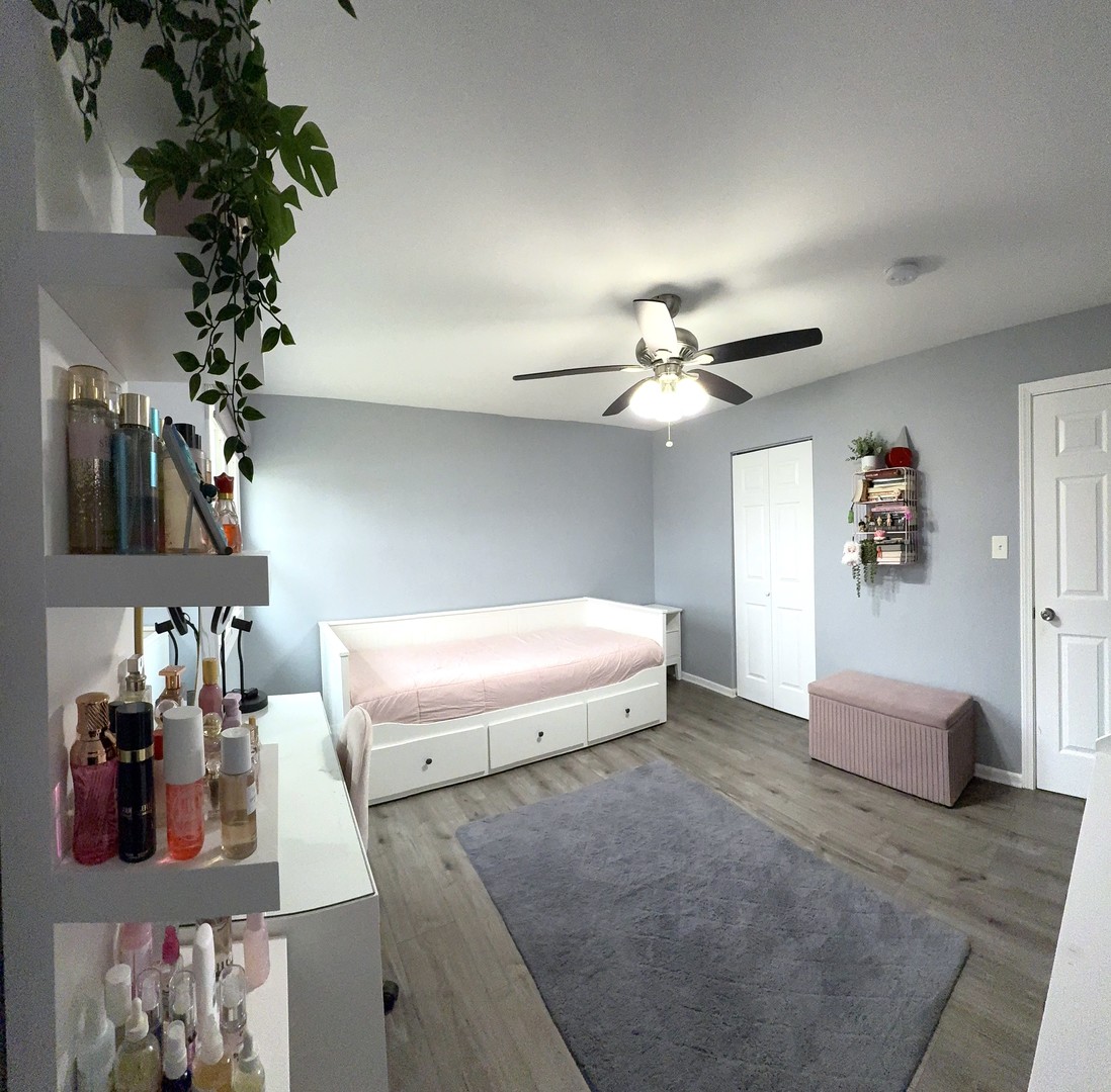 8001 North Elmore Street Niles, IL 60714 - Photo 17 of 34 a living room with furniture and a chandelier