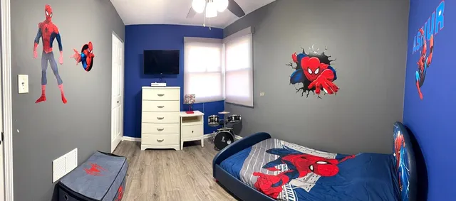 a bed room with a bed and a couch