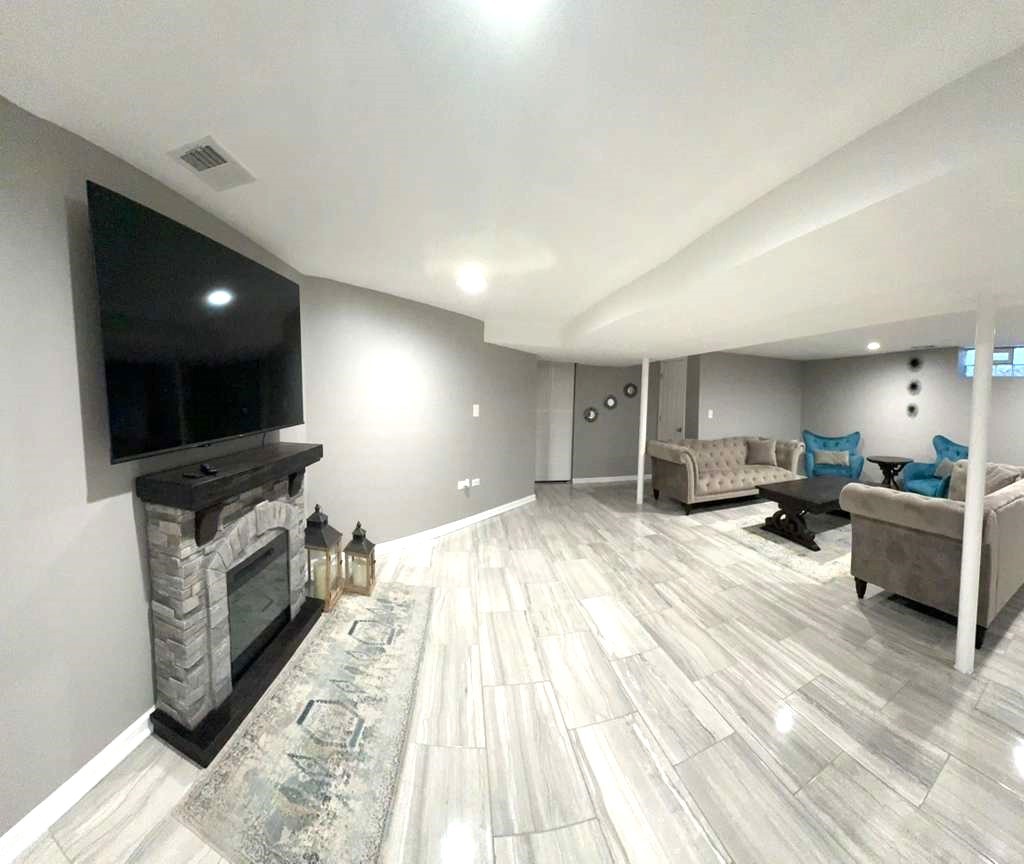 8001 North Elmore Street Niles, IL 60714 - Photo 31 of 34 a large kitchen with stainless steel appliances kitchen island a large counter top a stove and a sink