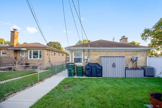 a front view of house with yard and outdoor seating