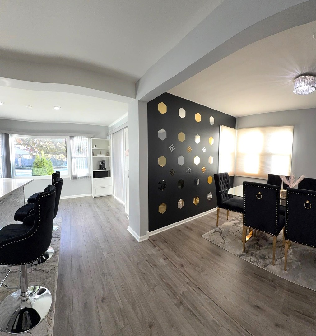 8001 North Elmore Street Niles, IL 60714 - Photo 9 of 34 a view of a living room and dining room