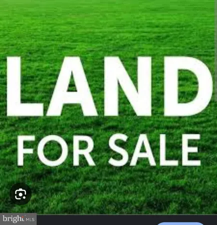 a view of an house with backyard space and outdoor seating