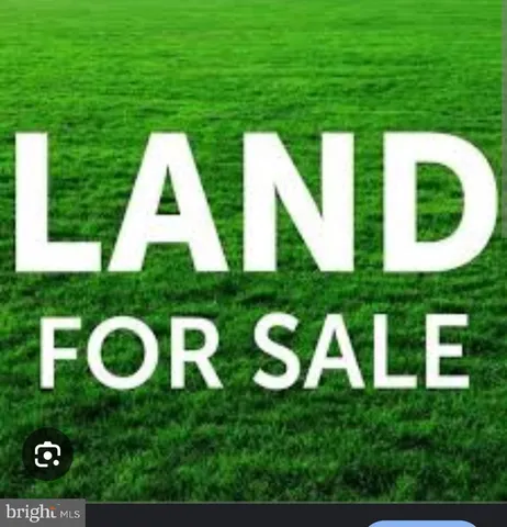 a view of an house with backyard space and outdoor seating