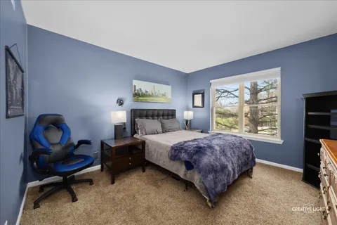 a bedroom with bed and a window