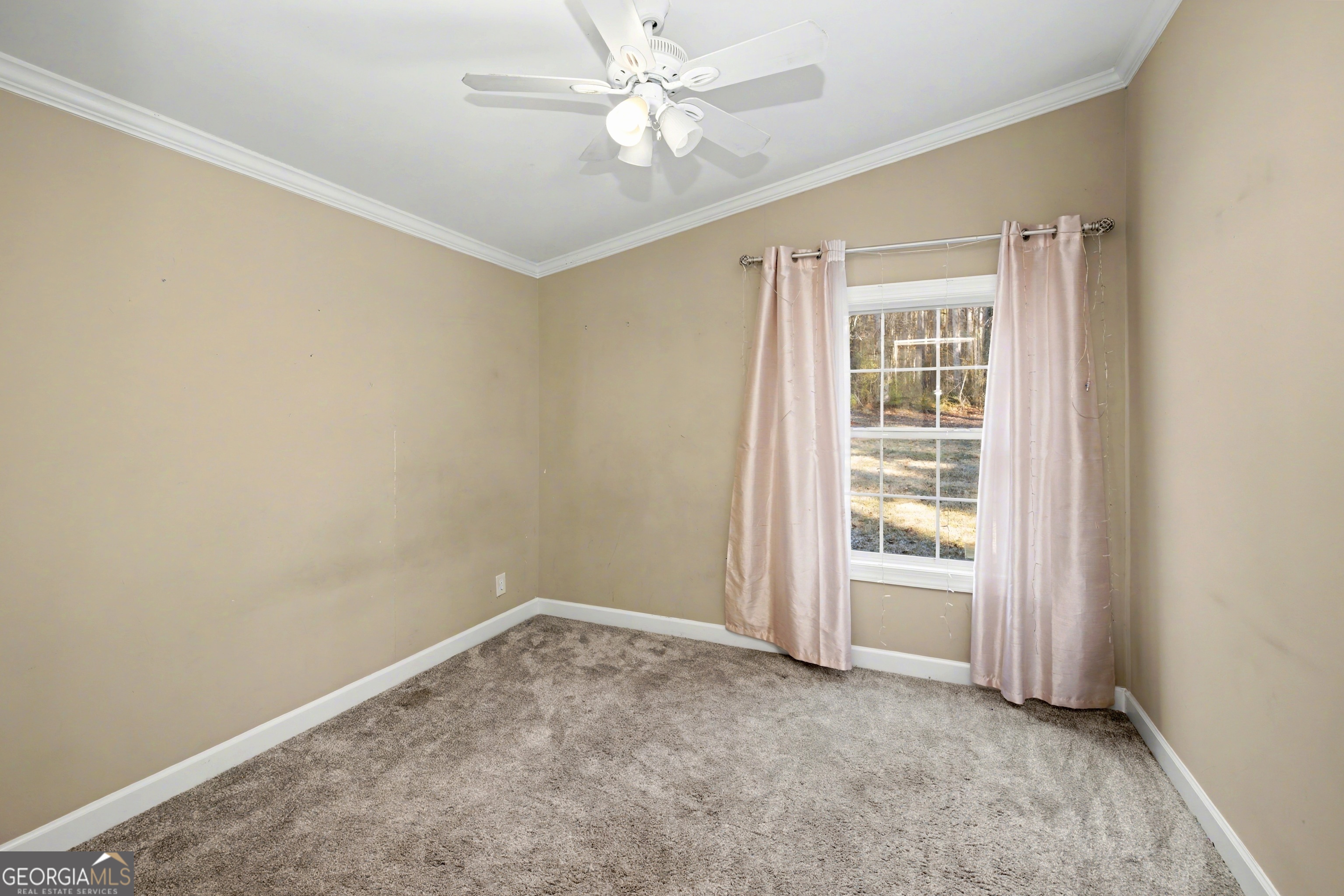 90 Cooksville Road Hogansville, GA 30230 - Photo 17 of 26 an empty room with windows and fan