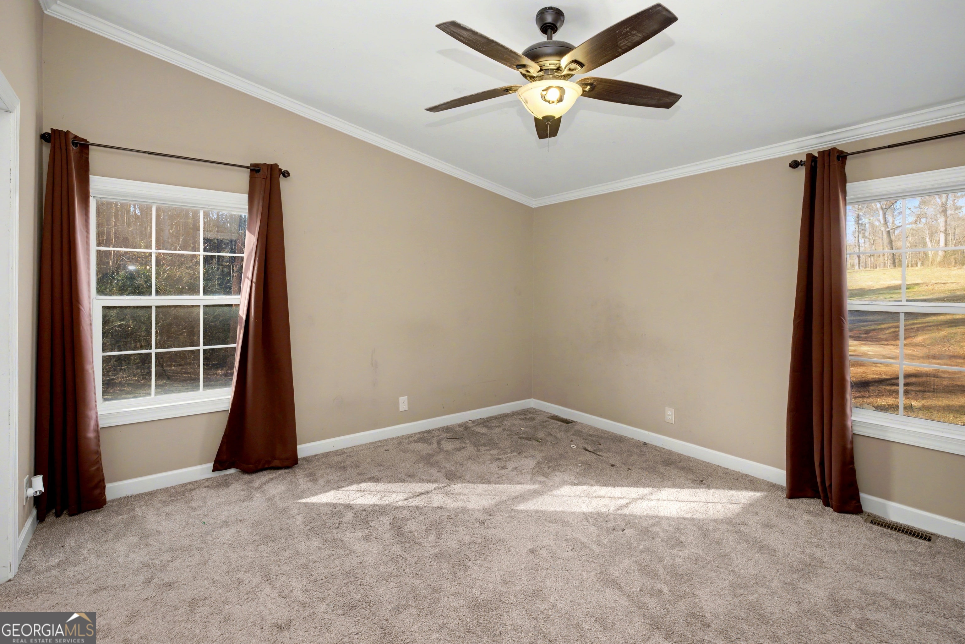 90 Cooksville Road Hogansville, GA 30230 - Photo 19 of 26 an empty room with windows and ceiling fan