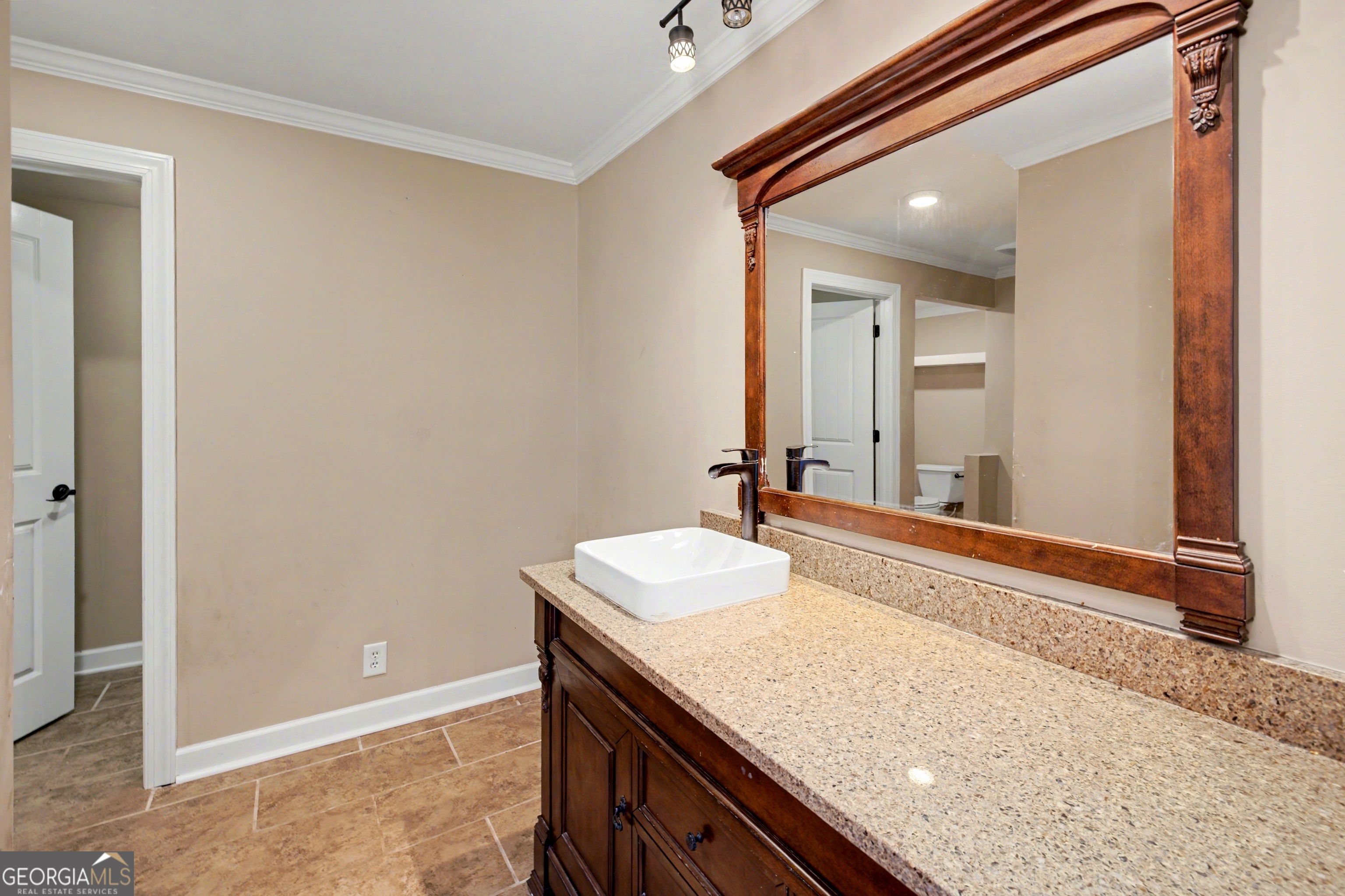 90 Cooksville Road Hogansville, GA 30230 - Photo 21 of 26 a bathroom with a granite countertop sink and a mirror