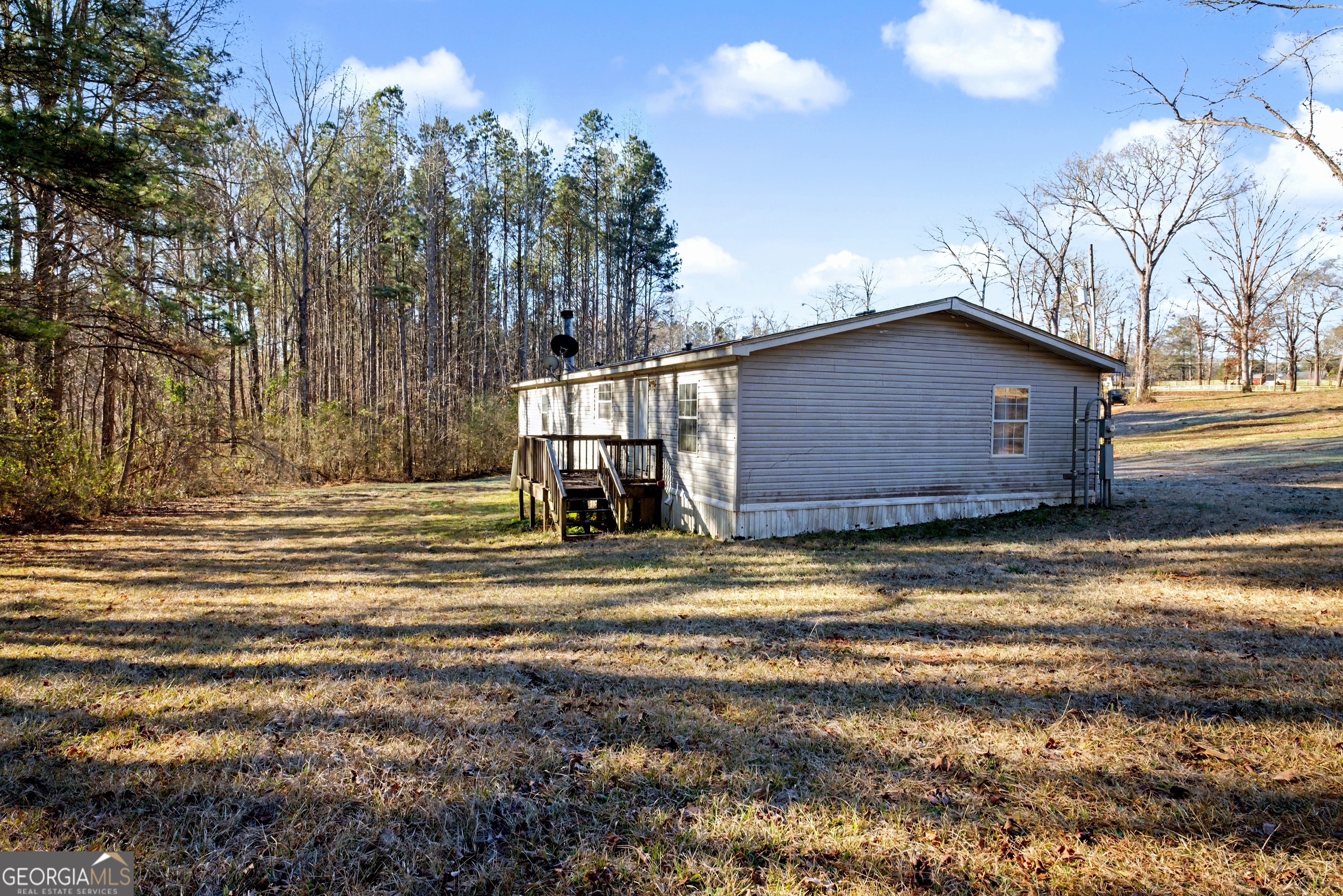90 Cooksville Road Hogansville, GA 30230 - Photo 26 of 26 a view of a house with a yard next to a road