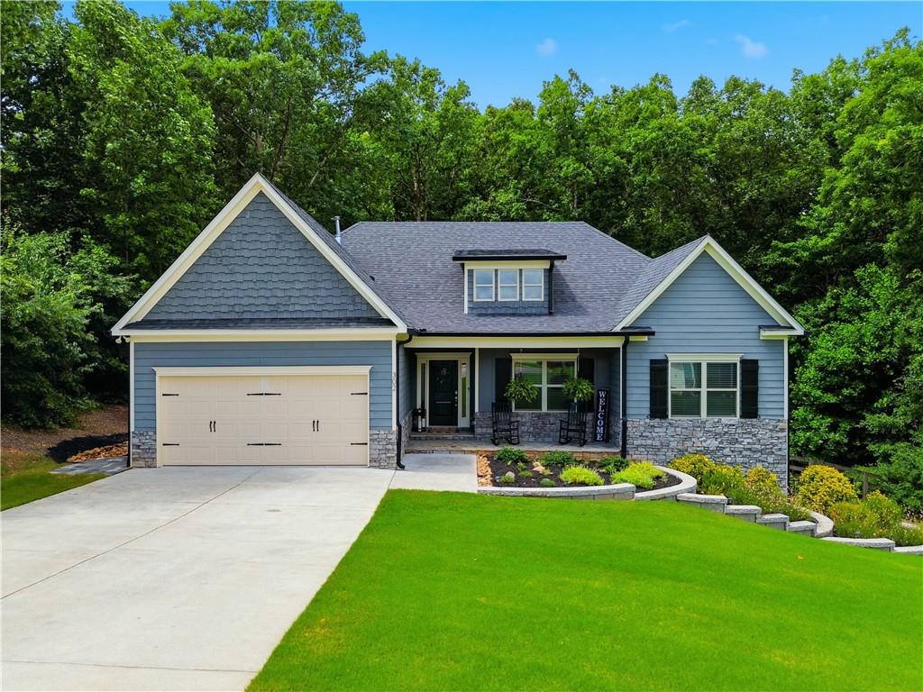 302 Spence Circle Ball Ground, GA 30107 - Photo 1 of 55 a front view of house with yard and green space