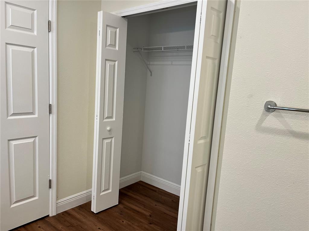 4441 Palmarito Street Sebring, FL 33872 - Photo 18 of 33 a view of an empty room with wooden floor