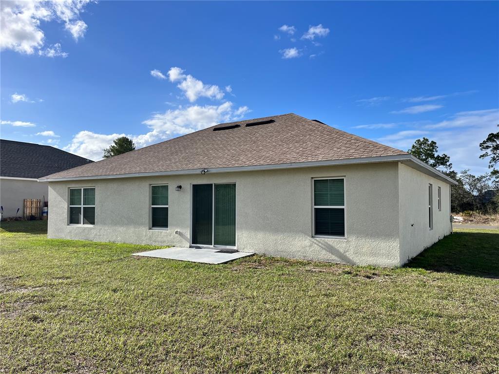 4441 Palmarito Street Sebring, FL 33872 - Photo 3 of 33 a view of a house with a yard