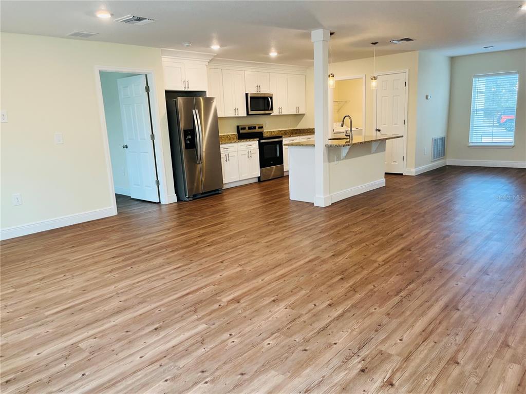 4441 Palmarito Street Sebring, FL 33872 - Photo 8 of 33 a view of kitchen view wooden floor and refrigerator