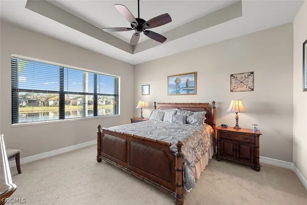 a bedroom with a bed dresser and a window