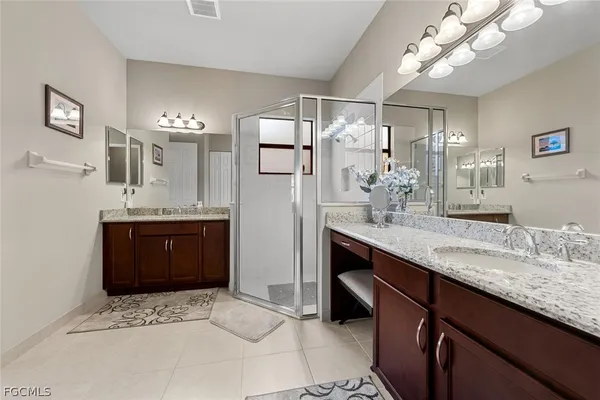 a bathroom with a sink a vanity and a mirror