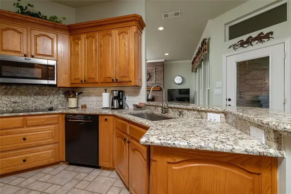 a kitchen with a stove and a sink